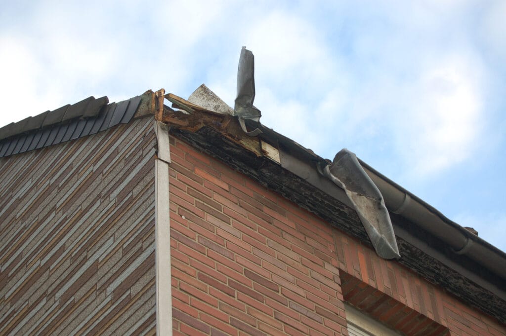 Gutter damage resulting from a storm that damaged a roof.